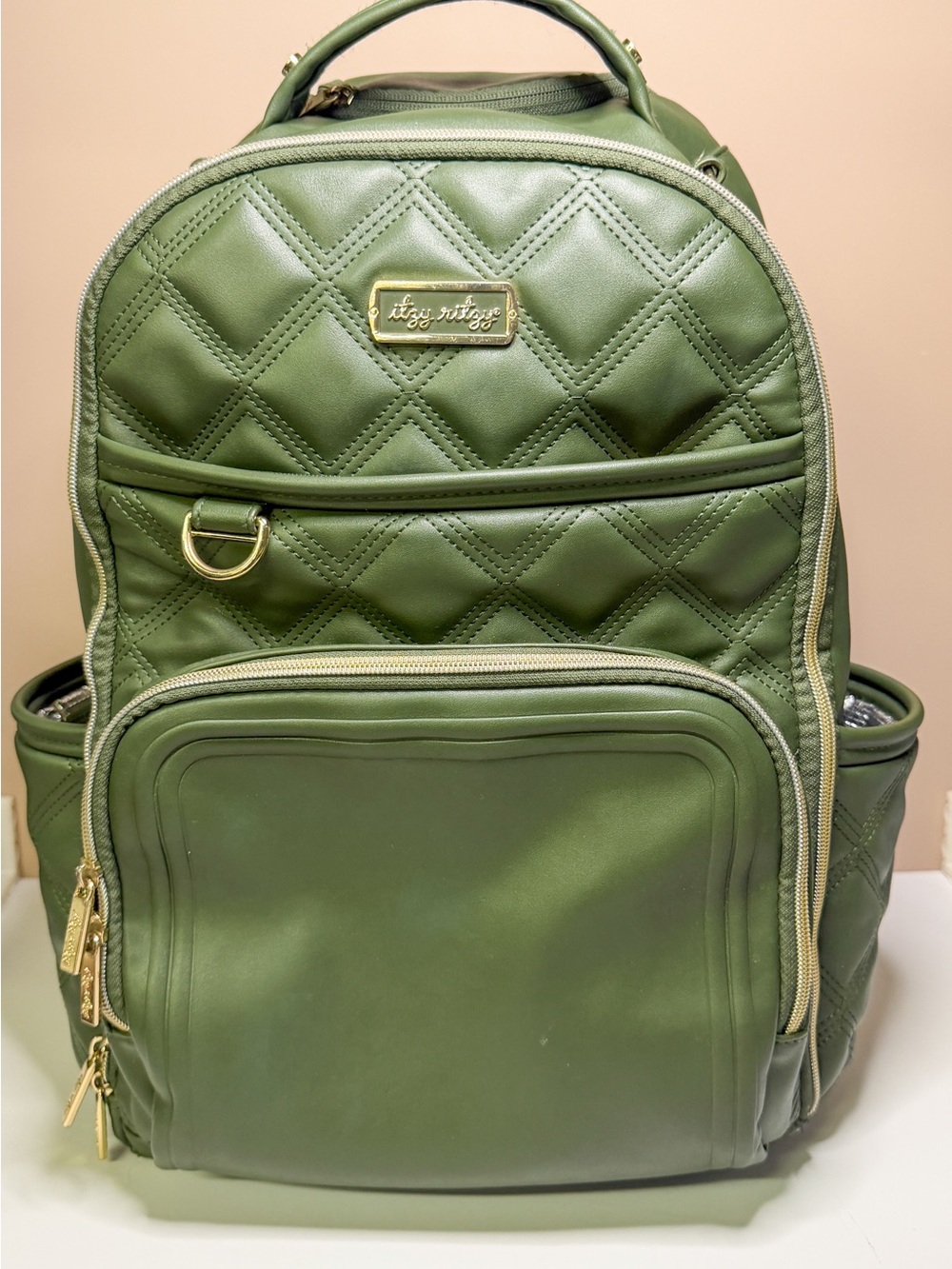 Itzy Ritzy Olive Green “miracle” boss plus diaper backpack